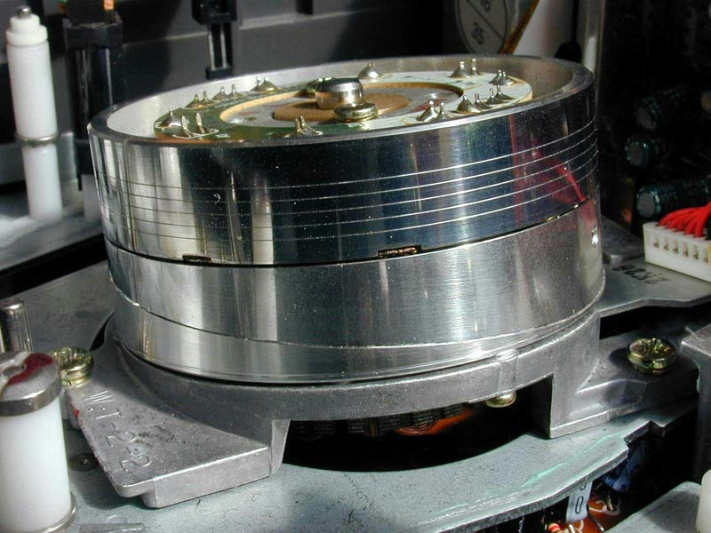 The helical scan is a method of recording high-frequency signals onto magnetic tape using a rotating drum outfitted with magnetic heads.